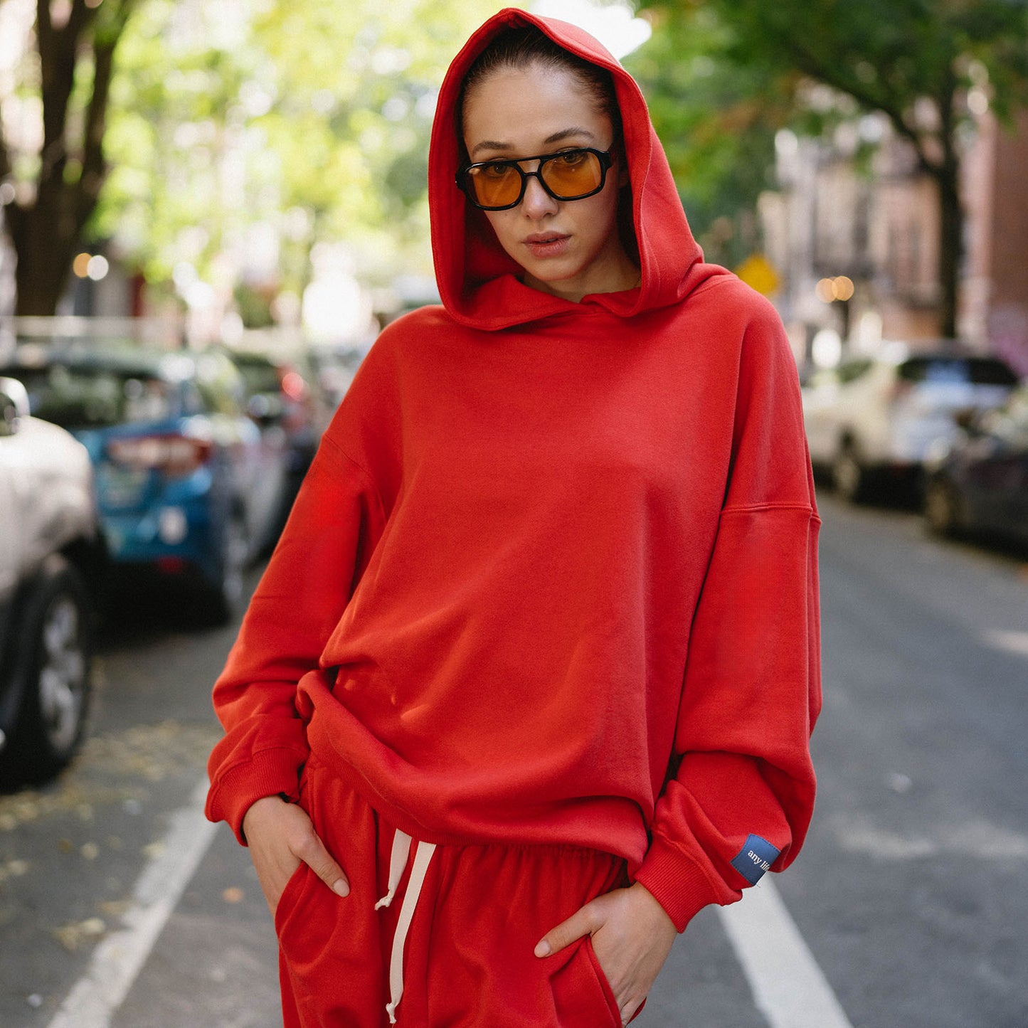 Red hoodie with long sleeves.